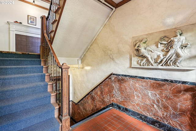 stairs with tile patterned flooring