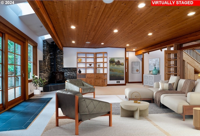 89464 Sunny Loop Ln, Bandon, OR 97411 - carpeted living area featuring wooden ceiling, recessed lighting, a wood stove, and stairs