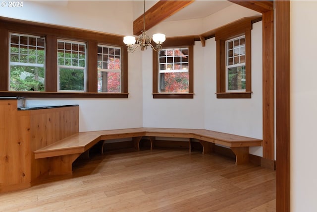 mudroom featuring beam ceiling, a chandelier, and light wood-type flooring