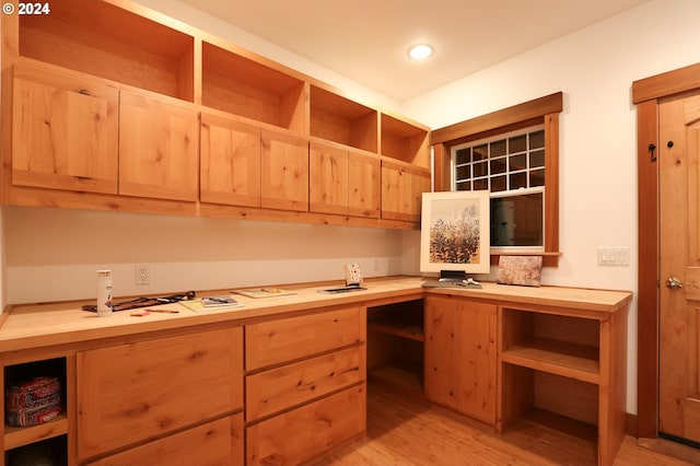 89464 Sunny Loop Ln, Bandon, OR 97411 - kitchen with open shelves, built in study area, light brown cabinets, and wood counters