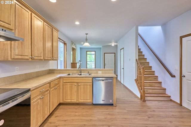 kitchen featuring light hardwood / wood-style flooring, sink, decorative light fixtures, and appliances with stainless steel finishes