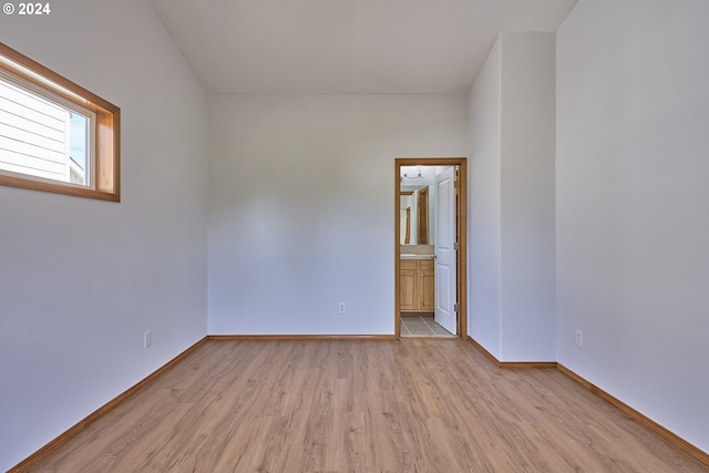 unfurnished room with light wood-type flooring