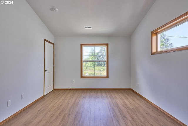 spare room featuring light hardwood / wood-style floors