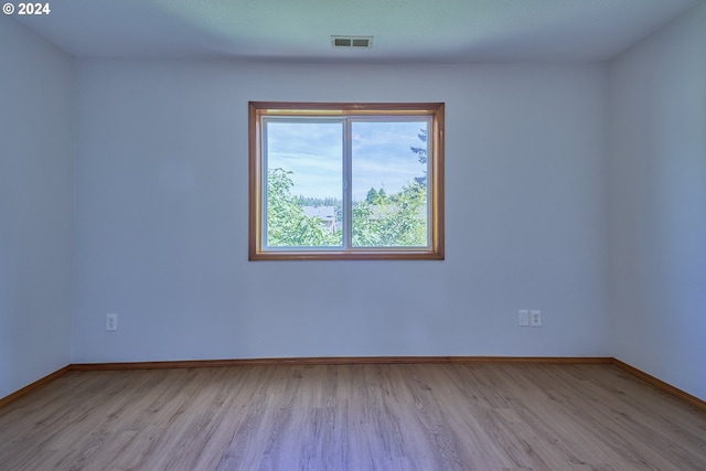 empty room with light wood-type flooring