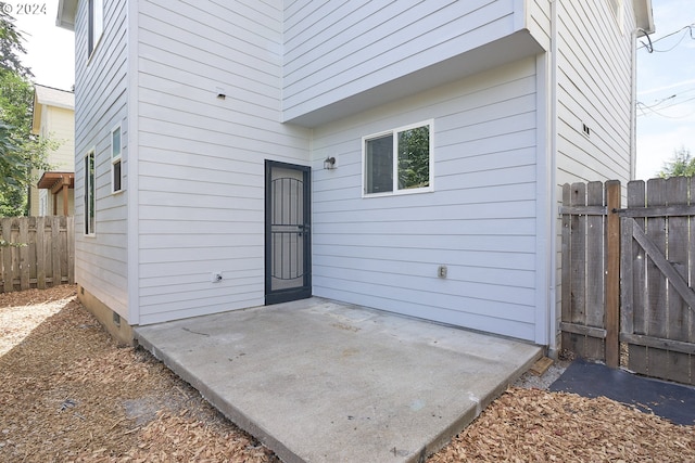 property entrance with a patio