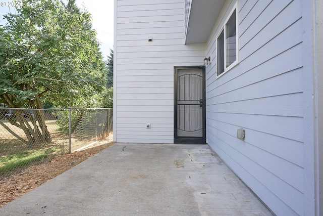 property entrance with a patio area