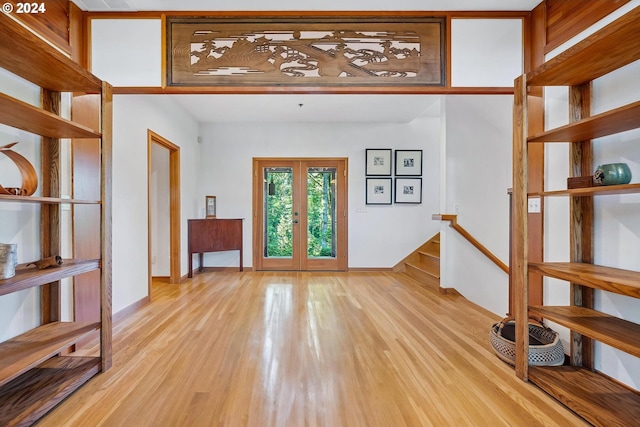 6733 NW Cornell Rd, Portland, OR 97229 - foyer with french doors, light wood-style flooring, and baseboards
