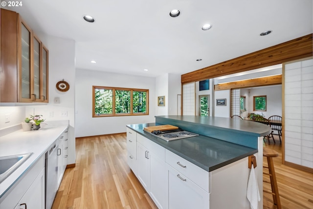 6733 NW Cornell Rd, Portland, OR 97229 - kitchen with light wood-style flooring, glass insert cabinets, recessed lighting, and white cabinetry