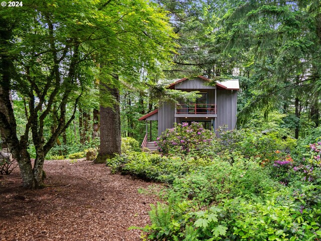 6733 NW Cornell Rd, Portland, OR 97229 - view of yard featuring an outbuilding and a wooded view