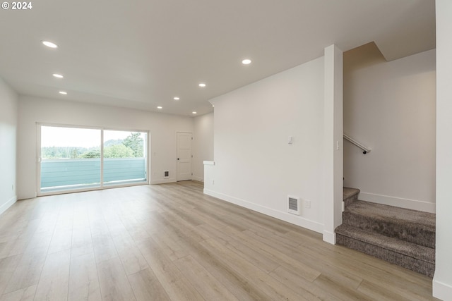 unfurnished room with light hardwood / wood-style floors