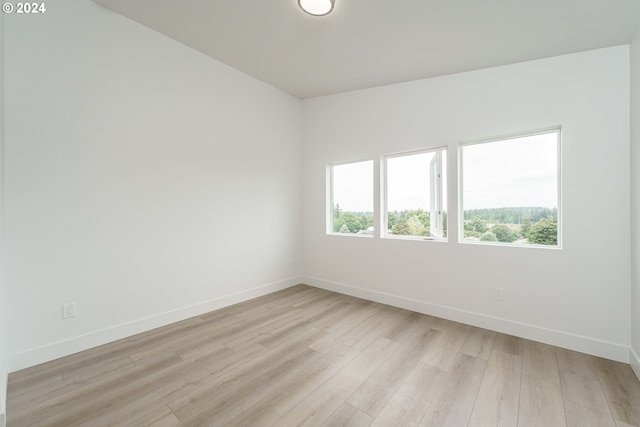 spare room with light hardwood / wood-style flooring