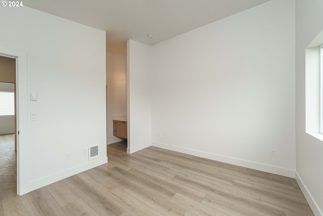 unfurnished room featuring light hardwood / wood-style flooring