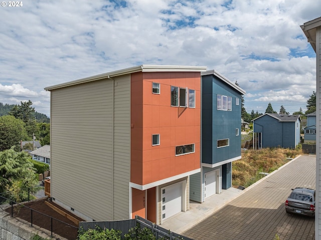 view of property exterior featuring a garage