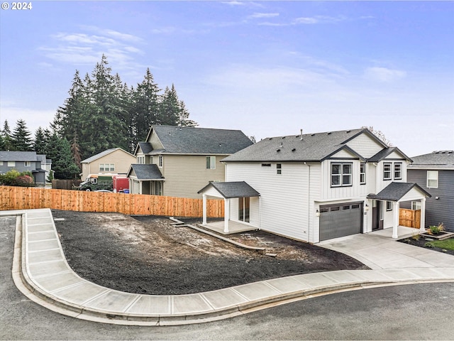 view of front of property featuring a garage