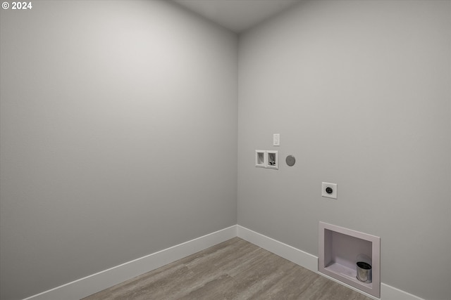 laundry room with hookup for an electric dryer, light wood-type flooring, and hookup for a washing machine