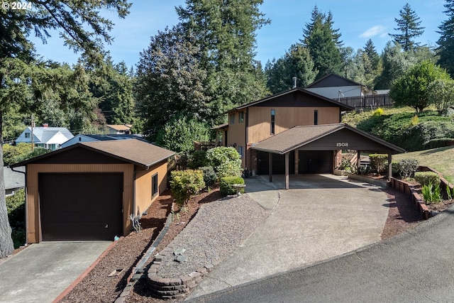 view of front of house with a carport and a garage