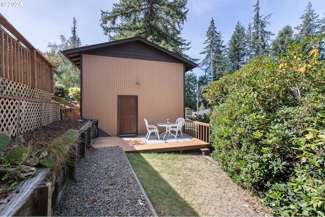 view of yard featuring an outbuilding and a wooden deck