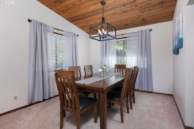 carpeted dining space with wood ceiling, vaulted ceiling, and a chandelier