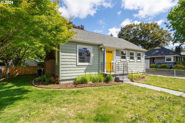 view of front of home with a front yard