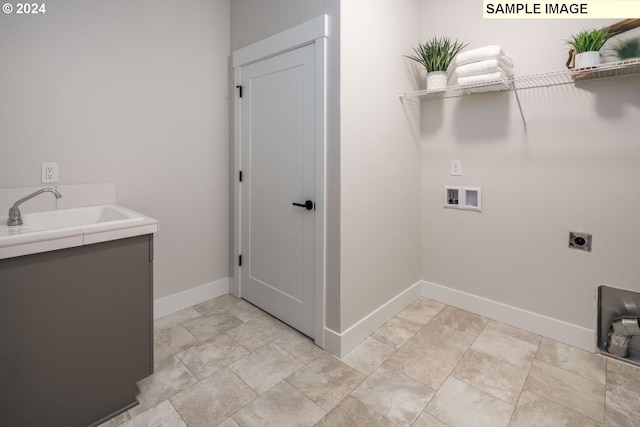 laundry room with hookup for an electric dryer, sink, and washer hookup