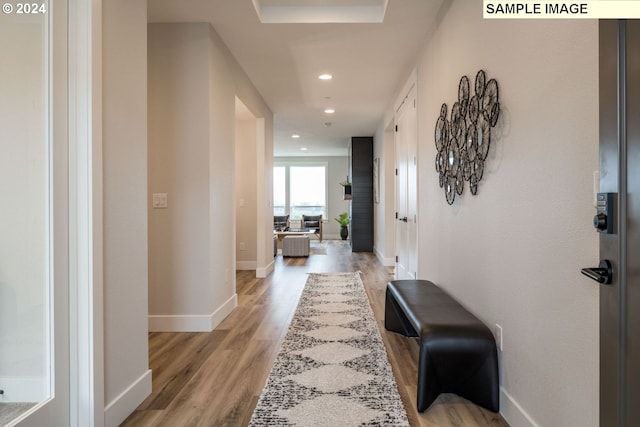 hallway with light hardwood / wood-style flooring