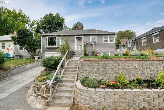 bungalow-style home with a garage