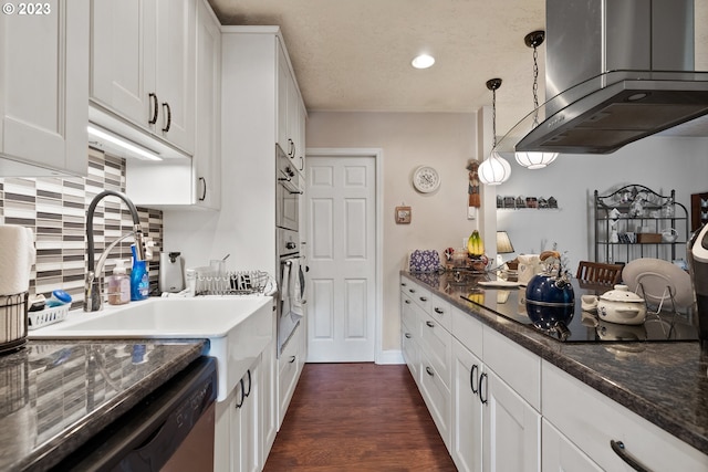 kitchen with dark hardwood / wood-style floors, black electric cooktop, hanging light fixtures, range hood, and white cabinets