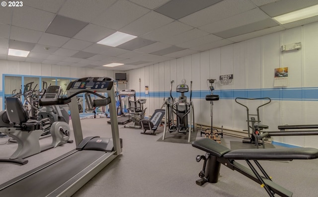 workout area featuring a paneled ceiling