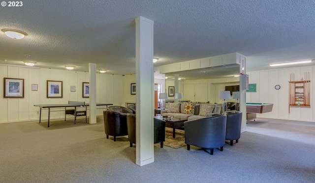 living room featuring a textured ceiling, light colored carpet, and billiards