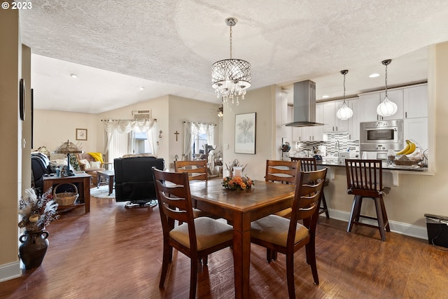 dining room with a textured ceiling, a chandelier, vaulted ceiling, and dark hardwood / wood-style flooring