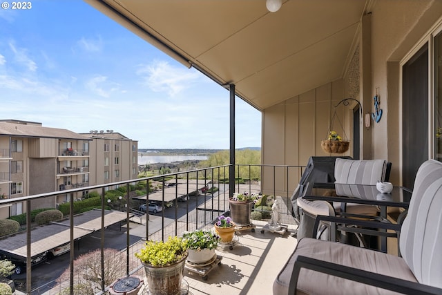 balcony featuring a water view