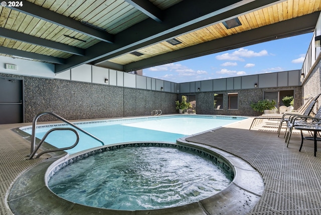 view of pool featuring a patio and a community hot tub