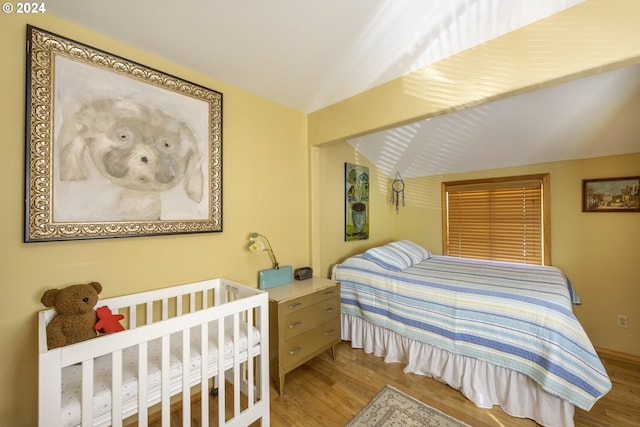 bedroom with hardwood / wood-style floors