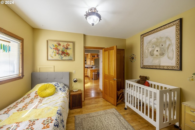 bedroom with light hardwood / wood-style floors