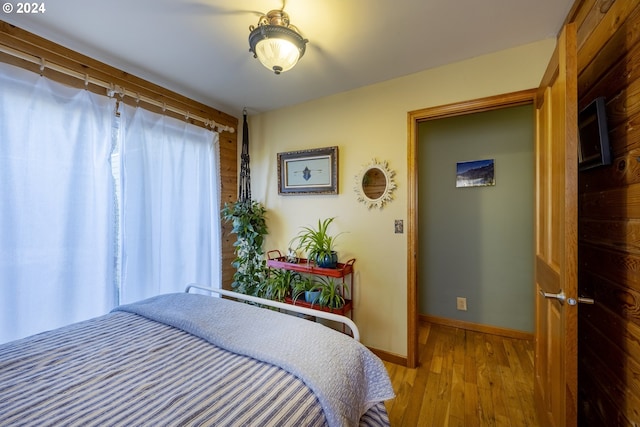 bedroom with wood-type flooring