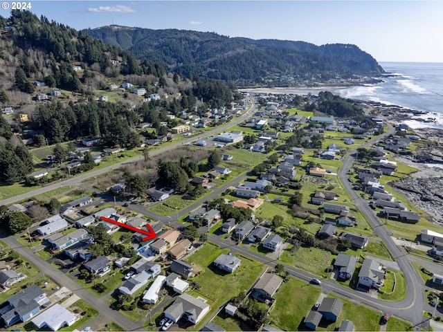 birds eye view of property featuring a water and mountain view