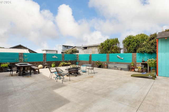 view of patio featuring a fire pit