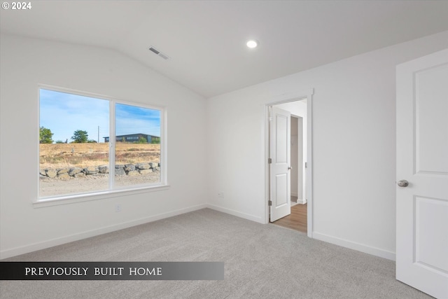 unfurnished bedroom featuring recessed lighting, visible vents, baseboards, vaulted ceiling, and carpet