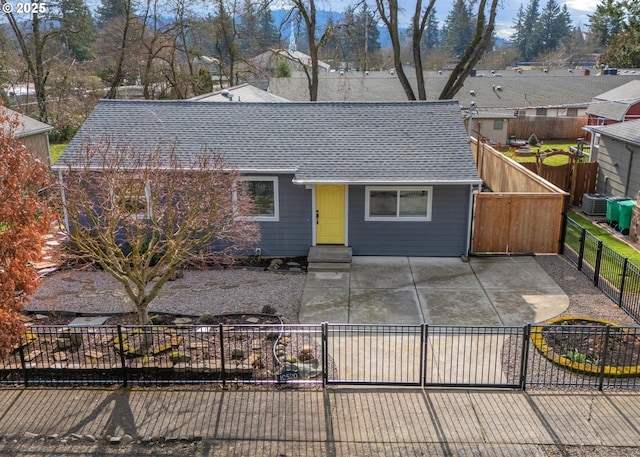 single story home featuring a patio and central air condition unit