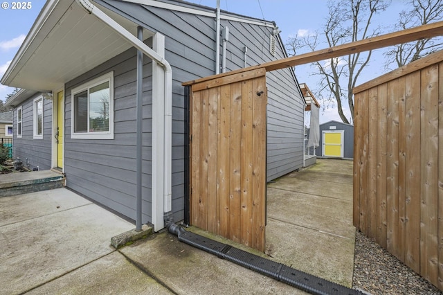 exterior space featuring a shed and a patio