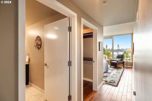 corridor featuring light hardwood / wood-style floors