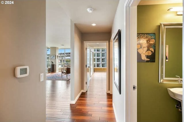 hallway with wood-type flooring