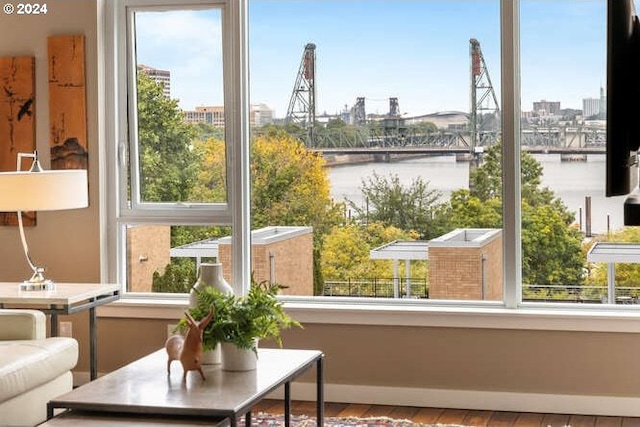 sunroom / solarium featuring a water view