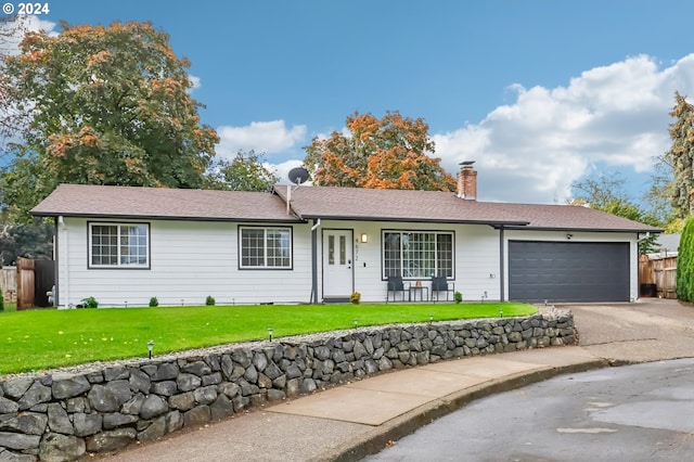 ranch-style house with a front lawn and a garage