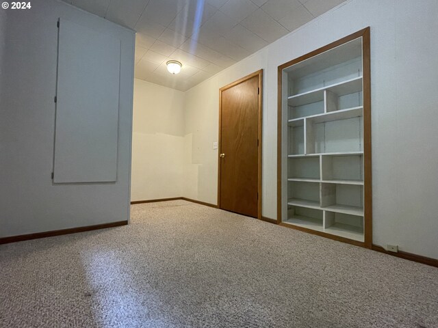 87535 Tiernan Rd, Mapleton, OR 97453 - carpeted spare room featuring baseboards and built in shelves
