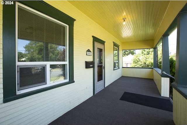 unfurnished sunroom with lofted ceiling