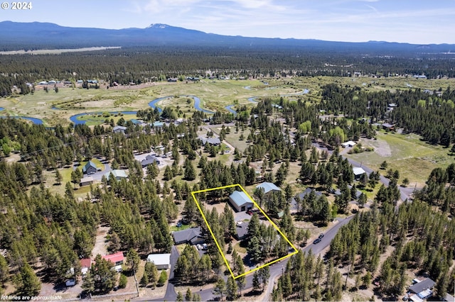 aerial view featuring a water and mountain view