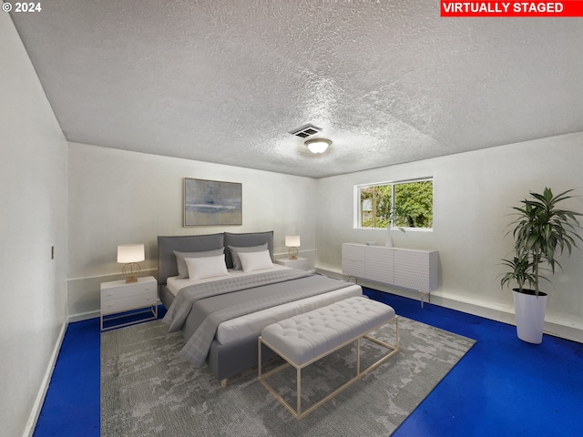 bedroom featuring a textured ceiling