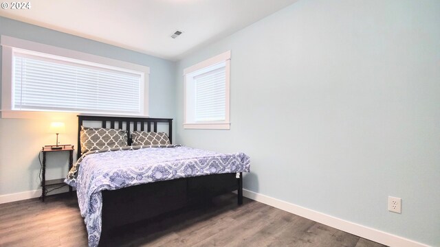 bedroom featuring wood-type flooring