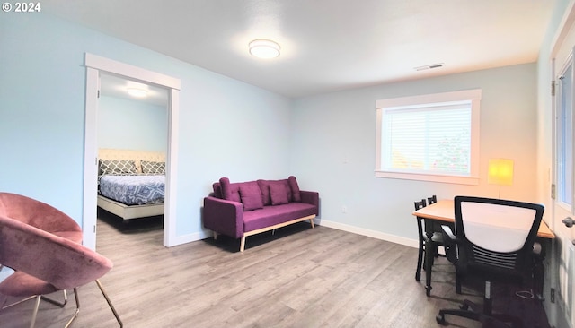 office space with light hardwood / wood-style flooring